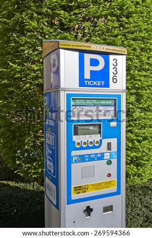 BRUSSELS, BELGIUM - APRIL 15, 2015: Brussels powered solar parking meter. Parking solutions have been growing in importance to deal with increasing congestion of parking spaces.