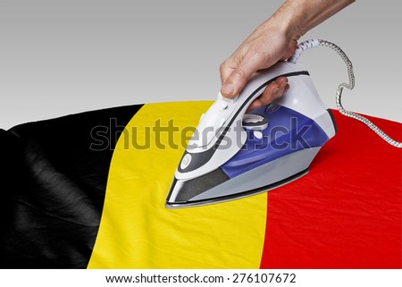 Steam iron for smooth out the wrinkles of Flag of Belgium