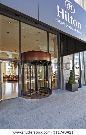 BRUSSELS,BELGIUM - 29 AUGUST 2015: The main entrance and the Glass revolving door at Hotel Hilton Grand Place in Brussels on 29 August 2015