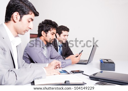 small group of young businessmen in office meeting