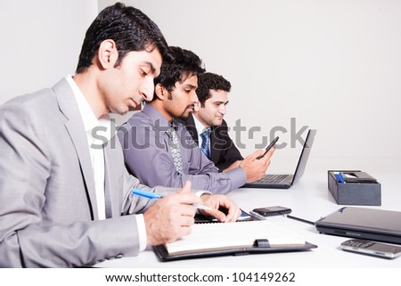 small group of young businessmen in office meeting