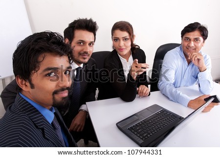 group of multi racial business people in meeting, Indian business woman in meeting with young businessmen.