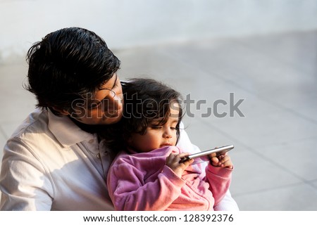 father and daughter using PC tablet, Indian man with his daughter