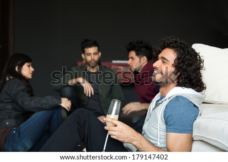 multiethnic group of friends hanging out on saturday night. Partying on saturday night