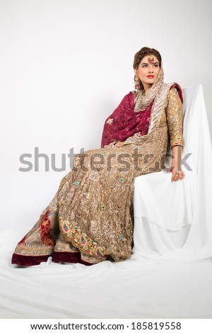full length portrait of a beautiful indian bride.