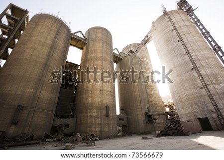 a group of silos at a cement factory.
