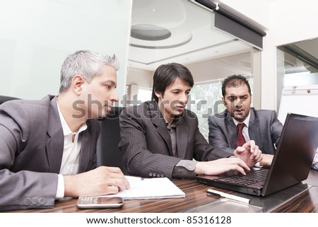 A diverse group of young business executives having a meeting with a senior businessman