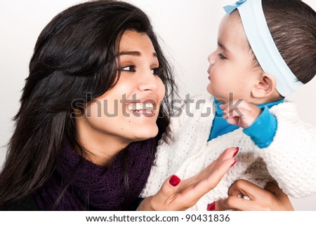 Indian family, portrait of happy Indian mother with little baby girl