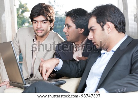 group of multi ethnic businessmen, indian businessman in a meeting with his colleagues