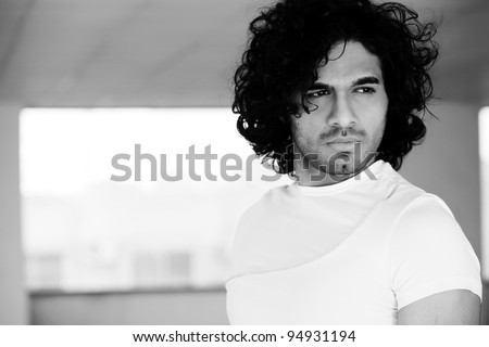 portrait of a confident man with afro hair style,