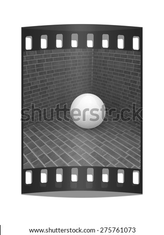 The white plastic ball in the corner of a brick . The film strip