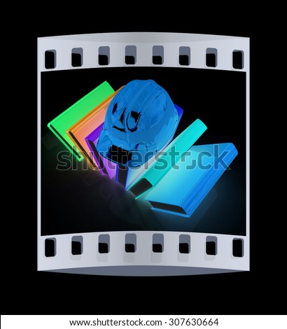 Colorful books and hard hat on a black background. The film strip