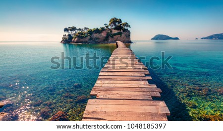 Photo of Bright spring view of the Cameo Island. Picturesque morning scene on the Port Sostis, Zakinthos island, Greece, Europe. Beauty of nature concept background.