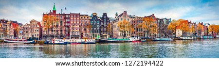 Panoramic autumn view of Amsterdam city. Famous Dutch channels and great cityscape. Colorful morning scene of Netherlands, Europe. Traveling concept background. ストックフォト © 