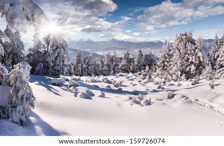 Walking in winter mountains after heavy snowfall