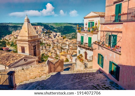 Сharm of the ancient cities of Europe. Sunny spring cityscape of Ragusa town with Church of St Mary of the Stairs on background. Wonderfulmorning scene of Sicily, Italy, Europe. 