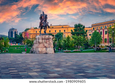 Splendid spring view of monument of Skanderbeg in Scanderbeg Square. Picturesque sunset in capital of Albania - Tirana. Traveling concept background. Foto stock © 