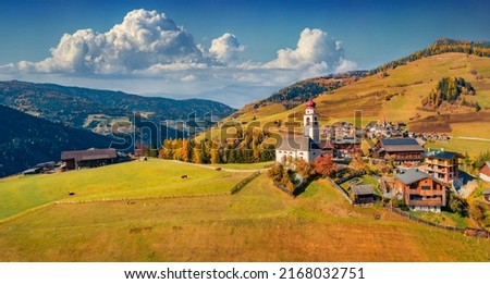 Panoramic autumn view from flying drone of Dlijia Da Curt Catholic church, Mareo, Province of Bolzano - South Tyrol, Italy, Europe. Sunny morning scene of Dolomite Alps. Traveling concept background. Imagine de stoc © 