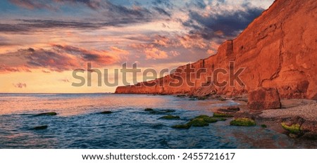 Similar – Foto Bild Meeresufer mit majestätischem Berg unter bewölktem Himmel