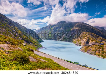Colorful summer morning on the Grimselsee lake. View from the Grimselpass. Alps, Switzerland, Europe.