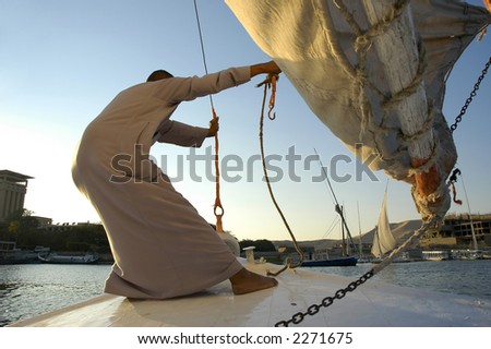 Boy catching wind. Egypt, Nile river