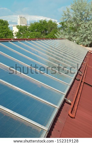 Solar water heating system on the red roof. Gelio panels.