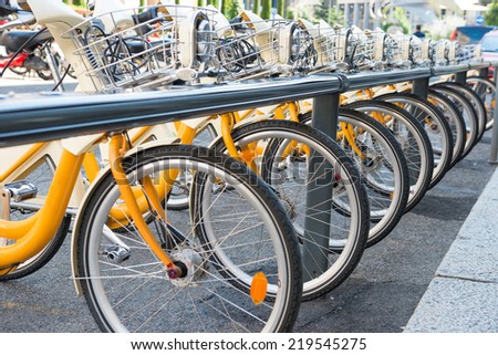 Yellow bikes parking on the street in Europe