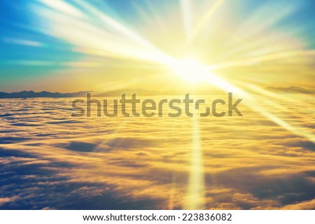 Amazing view from plane on the sky, sunset sun and clouds