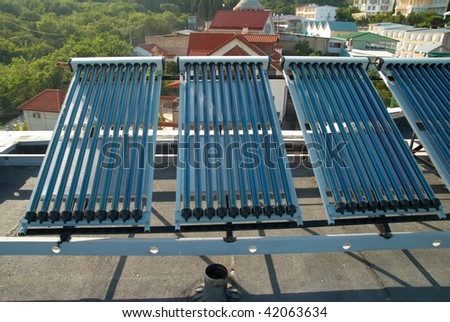 Vacuum solar water heating system on the house roof.
