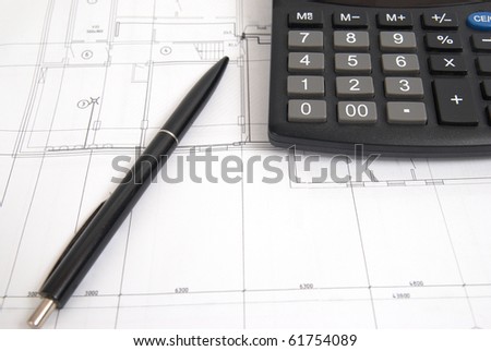 Working drawing with calculator and pen. Engineering equipment.