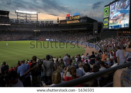 record crowd at Turner Field watches Nascar Cars go by in the outfield