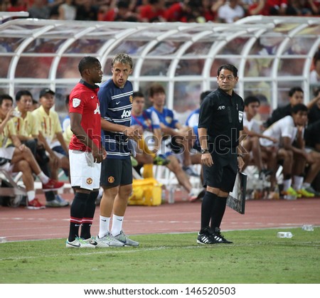 BANGKOK - JULY 13:Patrice Evra of Man Utd. waiting for substitute in the Singha 80th Anniversary Cup Manchester United vs Singha All Star at Rajamangala Stadium on July 13, 2013 in Bangkok, Thailand.