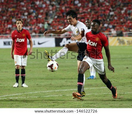 BANGKOK - JULY 13:Danny Welbeck (R) of Man Utd.  in action during Singha 80th Anniversary Cup Manchester United vs Singha All Star at Rajamangala Stadium on July 13,2013 in Bangkok, Thailand.