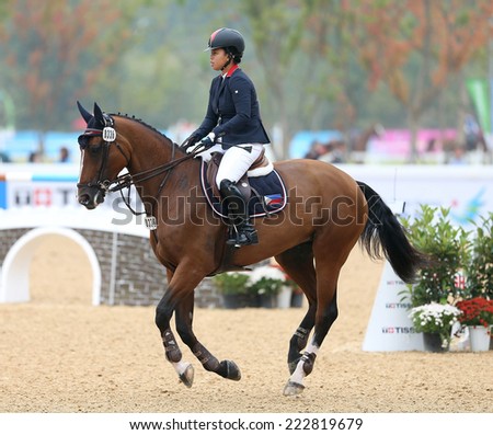 INCHEON - SEP 28:ARROYO Joker of Philippines in action during the 2014 Incheon Asian Games at Dream Park Equestrian Venue on September 28, 2014 in Incheon, South Korea.