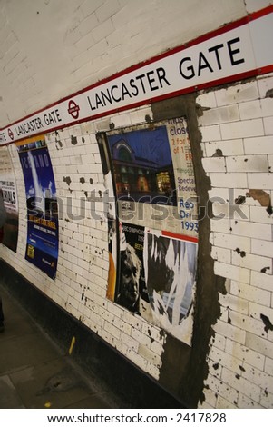 Aged London Underground Station Wall With Ad Posters Stock Photo ...