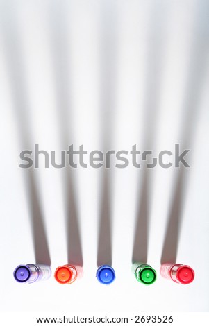 Colored pens (markers) with shadows over white background. View from above. Background have specific texture of tissue and don\'t  have noise.