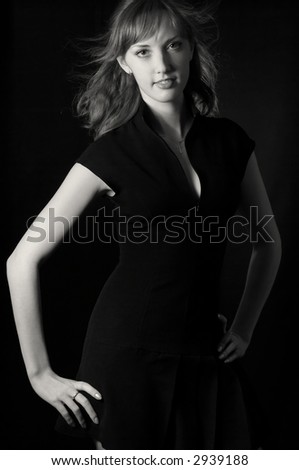 Lady in black over black background. black&white
