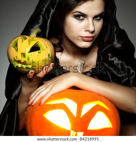 Sexual brunette in the suit of witch in night of Halloween