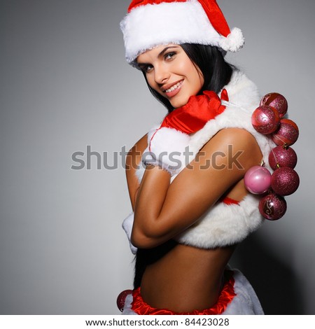 Beautiful and sexy woman wearing santa clause costume