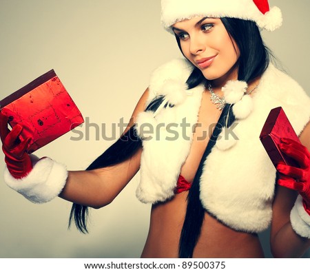 Beautiful and sexy woman wearing santa clause costume
