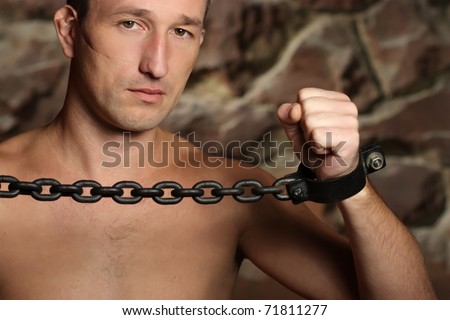 Man with a chains hands.