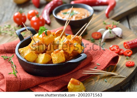 Similar – Image, Stock Photo Patatas bravas traditional Spanish potatoes snack tapas