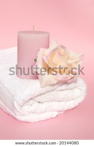 Pink Feminine spa still life with bath towel spa relaxing scented candle and rose