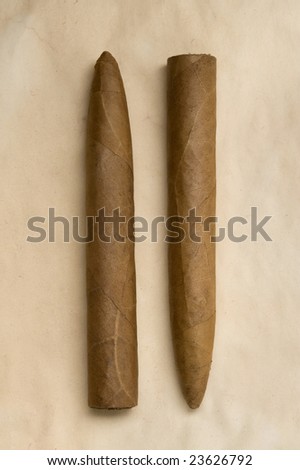 Pair of cigars on an old piece of paper.