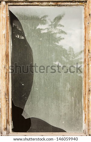 Broken window background texture with wooden frame