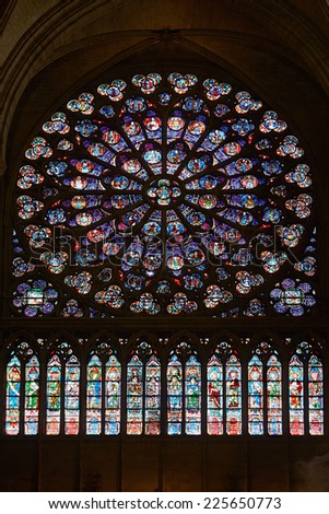 PARIS - JULY 6: Rose window in Notre Dame cathedral. This window, completed in 1225, was the reference for many other rose windows in Europe, on July 6, 2014 in Paris.