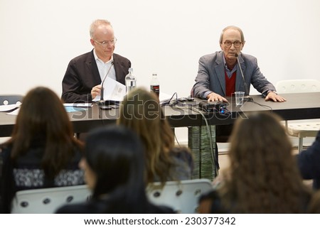 TURIN, ITALY - NOVEMBER 06: Hans Ulrich Obrist, art curator and critic speaks with painter Giorgio Griffa at Artissima, contemporary art fair vernissage on November 6, 2014 in Turin.