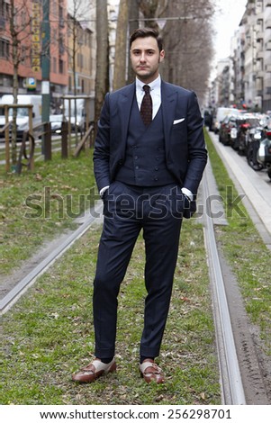 MILAN - FEBRUARY 25: Man poses for photographers before Gucci show Milan Fashion Week Day 1, Fall/Winter 2015/2016 street style day 1, on February 25, 2015 in Milan.