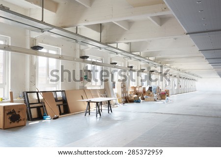 MILAN, ITALY - APRIL 15:  White, messy industrial interior before preparation during Milan design week on April 15, 2015 in Milan.
