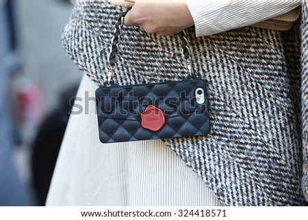 PARIS - SEPTEMBER 30: Smartphone cover like a bag seen before Rochas show, Paris Fashion Week Day 2, Spring / Summer 2016 street style on September 30, 2015 in Paris.